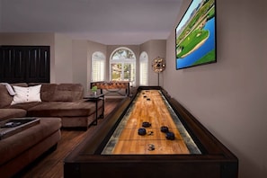 Shuffle board in front game room