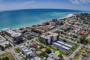 Lido Beach public access with parking is just .4 miles down the road or walk to the Ritz and enjoy the beach and tiki bar.