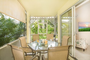 screened in porch with table for 6