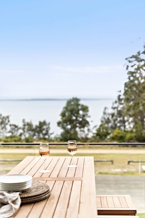 View from the balcony - Bench/stools,  1 x three-seater lounge & 2 x arm chairs