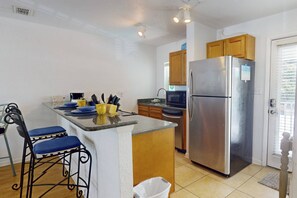 Fully Equipped Kitchen with Granite Countertops, Stainless Appliances, and all Necessary Cookware