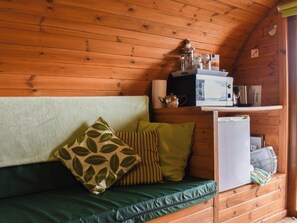 Modest kitchen/sitting area | Rivendell Glamping Pod - Well Farm Holiday Cottages, Holsworthy, near Launceston