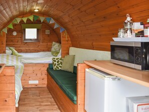 Small, yet oerfectly formed living space with single and double beds | Rivendell Glamping Pod - Well Farm Holiday Cottages, Holsworthy, near Launceston