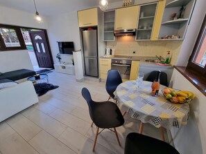 Kitchen area. kitchen with dining area and living room