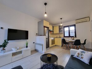 Living area. living room with kitchen and dining area