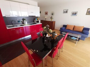 Kitchen area. Kitchen + dining + living room