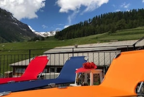 Large north-facing terrace with sun and sun loungers