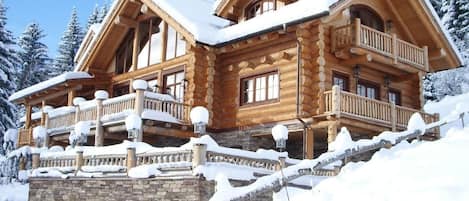 The Chalet is perched high in the Austrian alps in a forested area next to  lift station.