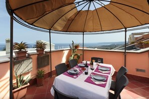 The terrace offers stunning views on the historic city center of Taormina and the Mediterranean