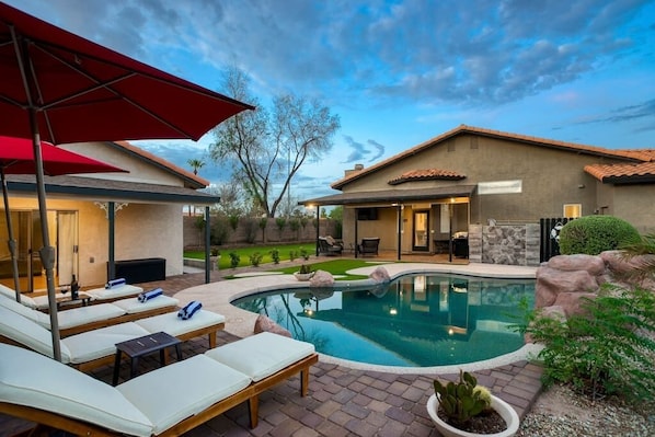 Backyard, heated pool w/ guesthouse to the left.