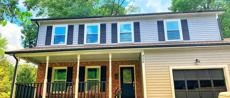 Relax on charming southern covered front porch with a book and a cup of coffee in the morning! String lights will automatically turn on at dusk and off at sunrise.