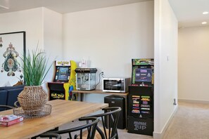 Upstairs family room with arcades and plenty of space for the whole group to gather