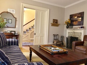 Living room looking into entry through pocket door