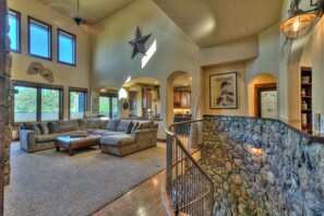 Open floor plan with natural stone throughout home.