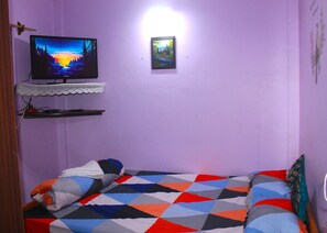 Bedroom 2 with 32 inch television and wardrobe.