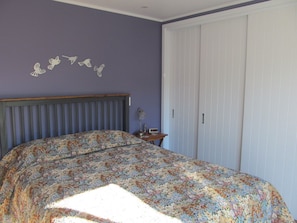 Queen bedroom with ample storage