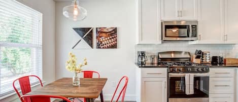 Fully stocked kitchen with dining for four