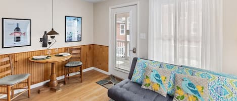 Lots of natural light filters into this condo with three big windows and a French entry door.