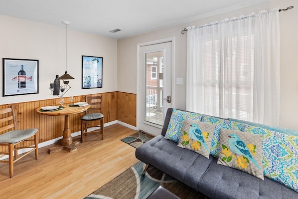 Lots of natural light filters into this condo with three big windows and a French entry door.