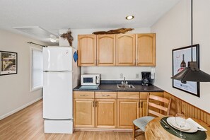 Kitchen has all essentials - microwave, toaster, fridge, coffee maker, single cooktop, even an electric kettle for tea.