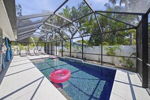 The home features a caged private pool!