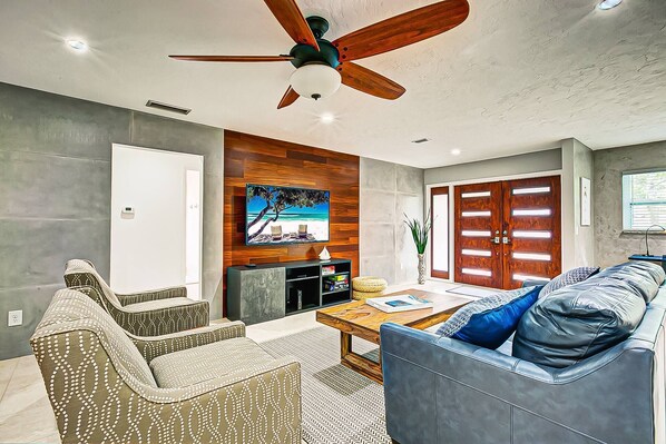 Living room with flat screen TV.... spacious and comfortable with high end finishings.