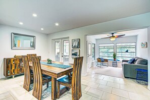 View from the kitchen to indoor dining area and den.