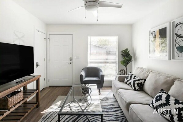 Living room with sleeper sofa and smart TV