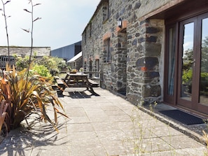 Paved patio area at entrance | Haywain - Trentinney Farm Holiday Cottages, St Endellion, near Port Isaac