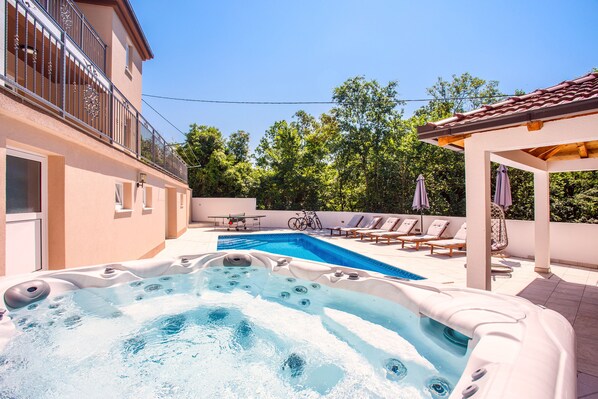 State of the art Jacuzzi is located next to the pool for your maximum pleasure 