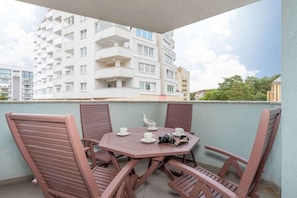 Balcony with garden furniture.
