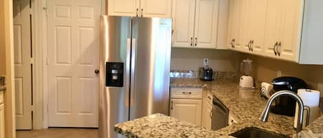 Updated and fully stocked Kitchen with all stainless appliances 