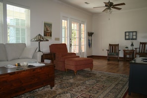 Living room with queen sleeper sofa and smart TV.