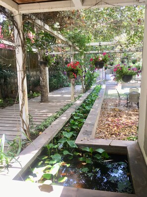 Artistic Walkway & Gardens lead you to the Villa.