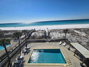 Balcony view of our pool and beachfront