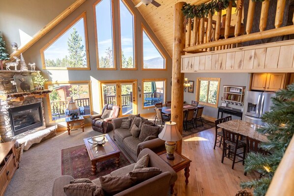 Relax by the fire in the spacious yet cozy living room.