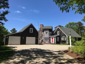 2-car garage and driveway that accommodates several cars