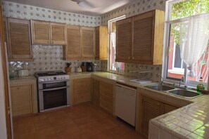 The full-kitchen has a all modern amenities including a dishwasher and microwave