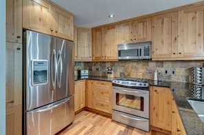 Alder wood kitchen cabinets - lots of storage