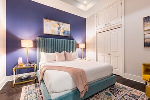 Spacious guest bedroom featuring king size bed and designer built in closet. The bedroom is equipped with hangers, luggage rack, alarm clock, white noise machine and 50'' Samsung Smart 4K TV for streaming apps, along with the DIRECTV Entertainment.
