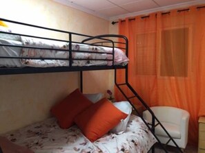 1 bedroom with a triple bunk