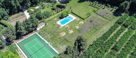 View to he house, the garden, the pool, the tennis court and part of the orchard