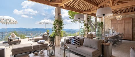 Covered Cabana with sofas, dining area, and panoramic terrace (off the kitchen)