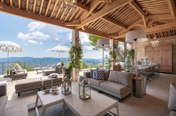 Covered Cabana with sofas, dining area, and panoramic terrace (off the kitchen)