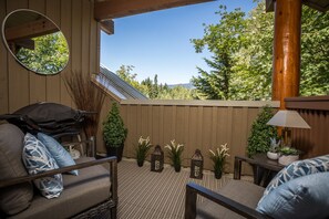 Enjoy relaxing on the private balcony tucked within the trees.