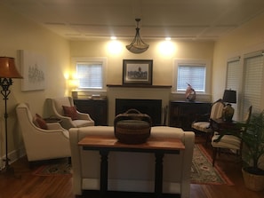 Living room with wood burning fireplace and comfortable seating