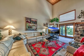 Living area with large flat screen cable TV.