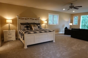 The master bedroom is expansive and features views of the Little Red River.