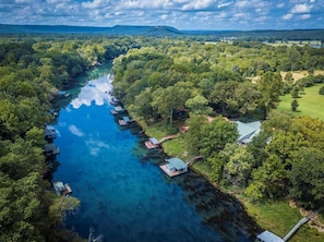 The Chateau's setting on the Little Red River is serene.