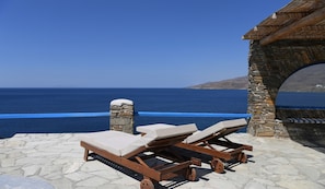 Relax by the pool overlooking the Aegean 